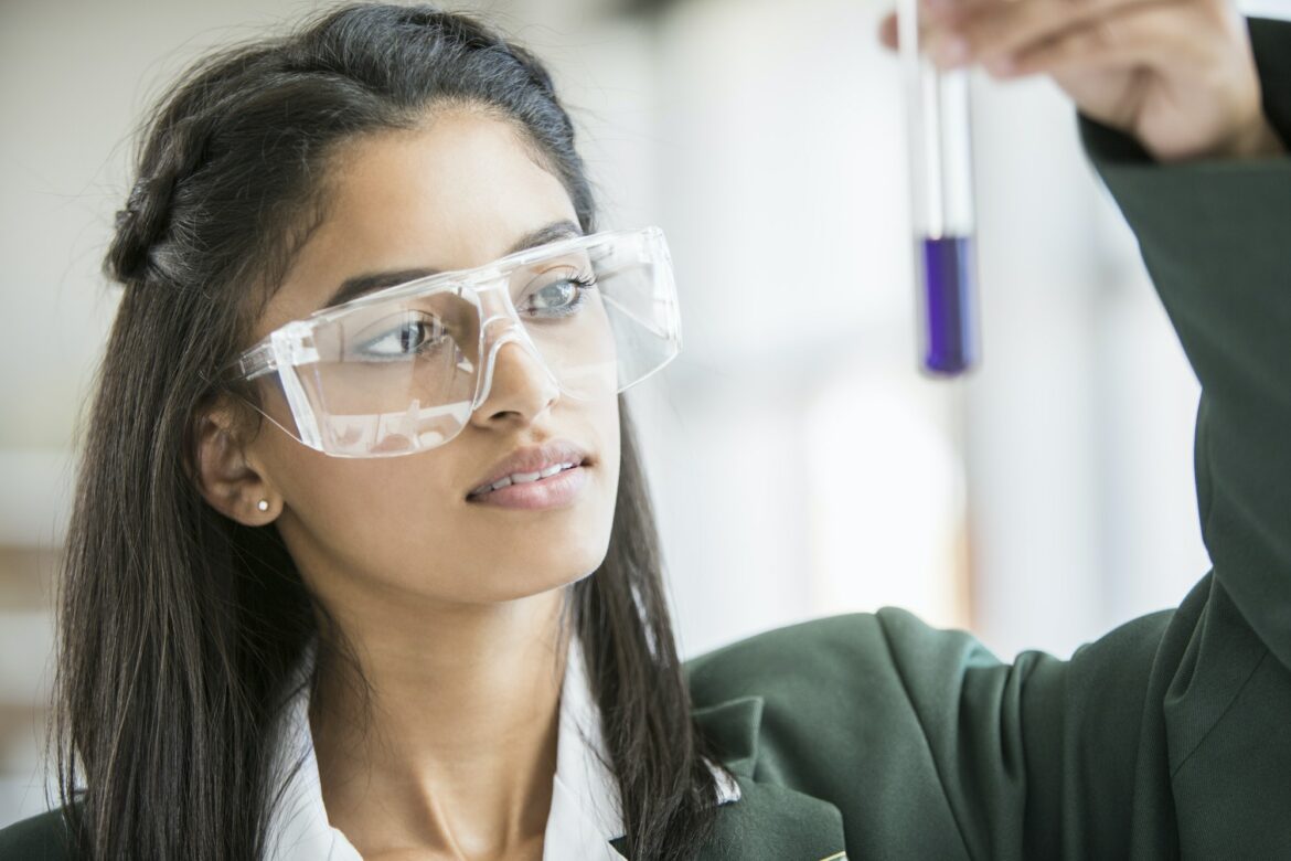 Student conducting experiment in lab Student conducting experiment in lab